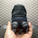 Front view of New Balance 9060 Triple Black U9060BPM sneakers, highlighting toe box and laces