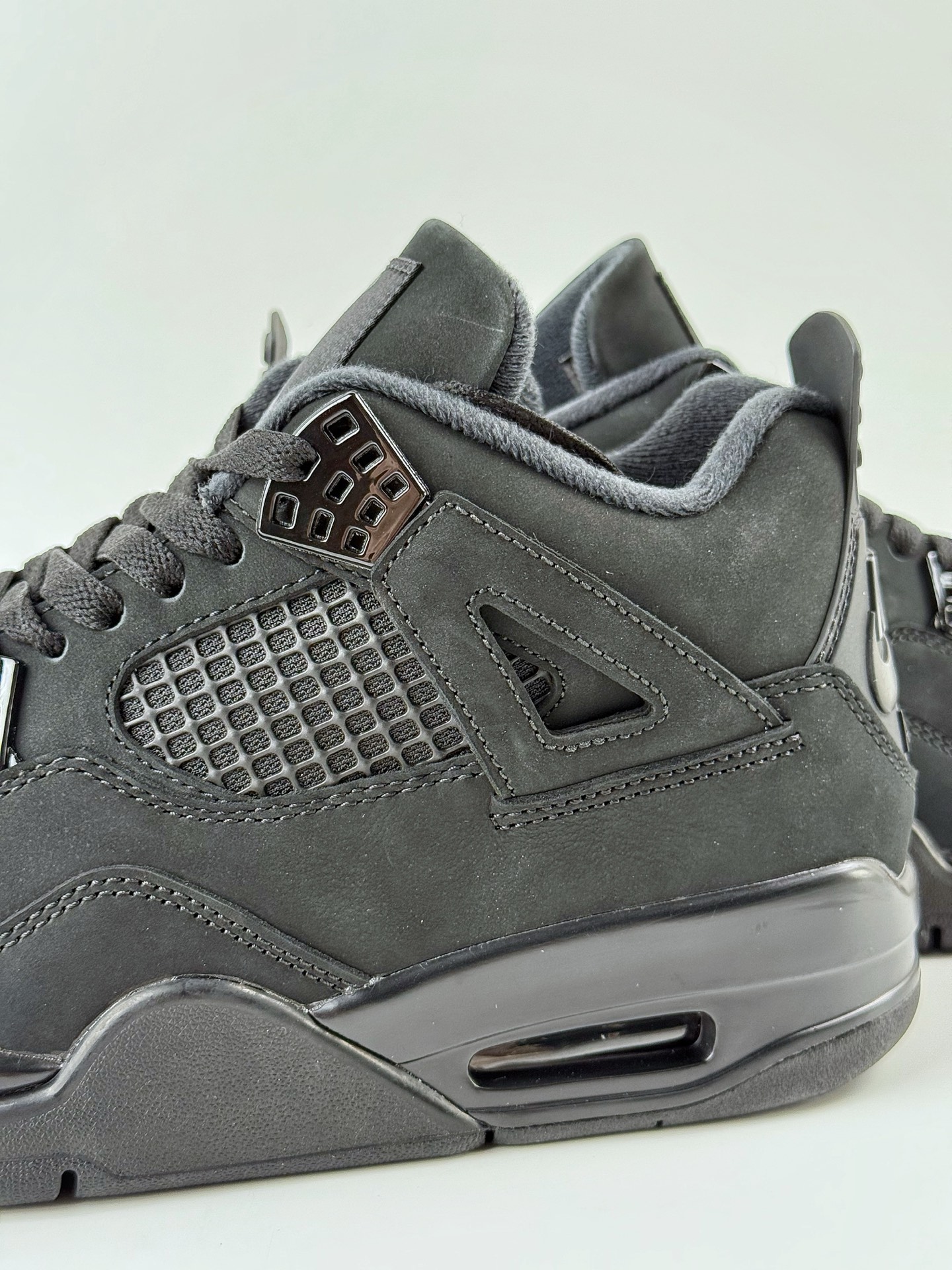 Jordan 4 Retro Black Cat (2025) 5 Jordan 4 Retro Black Cat 2025 streetwear, urban fashion, versatile black sneakers FV5029-010