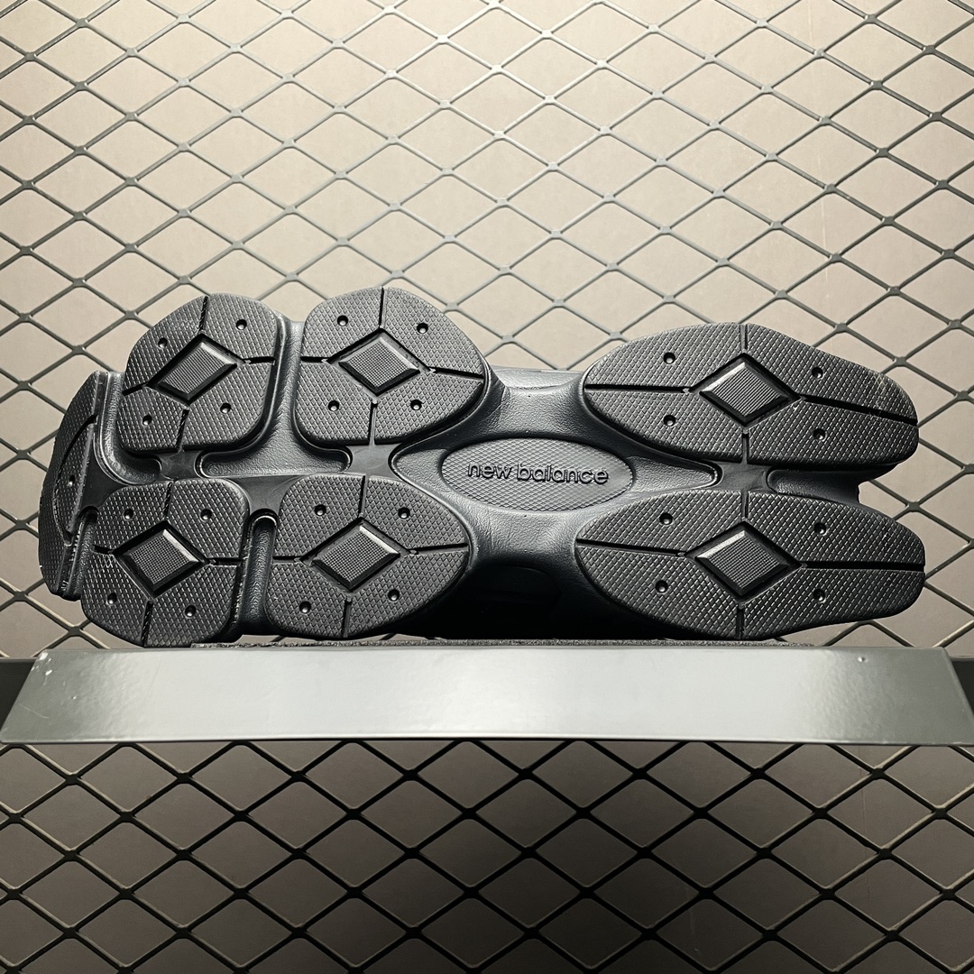 New Balance 9060 Triple Black sneakers on a clean surface, emphasizing premium materials