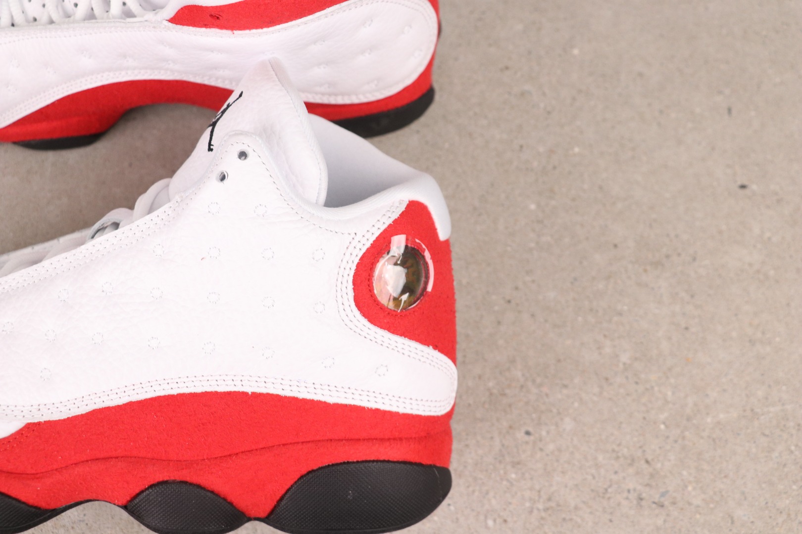 Jordan 13 Retro OG Chicago (2026) 4 Jumpman logo Jordan 13 Retro OG Chicago 2026 branding details