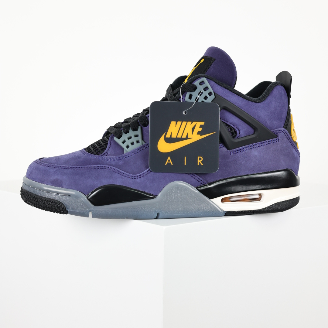 Jordan 4 Retro Lakers 4 Dynamic angled shot of Jordan 4 Retro Lakers FV5029-500 sneakers, emphasizing unique design elements