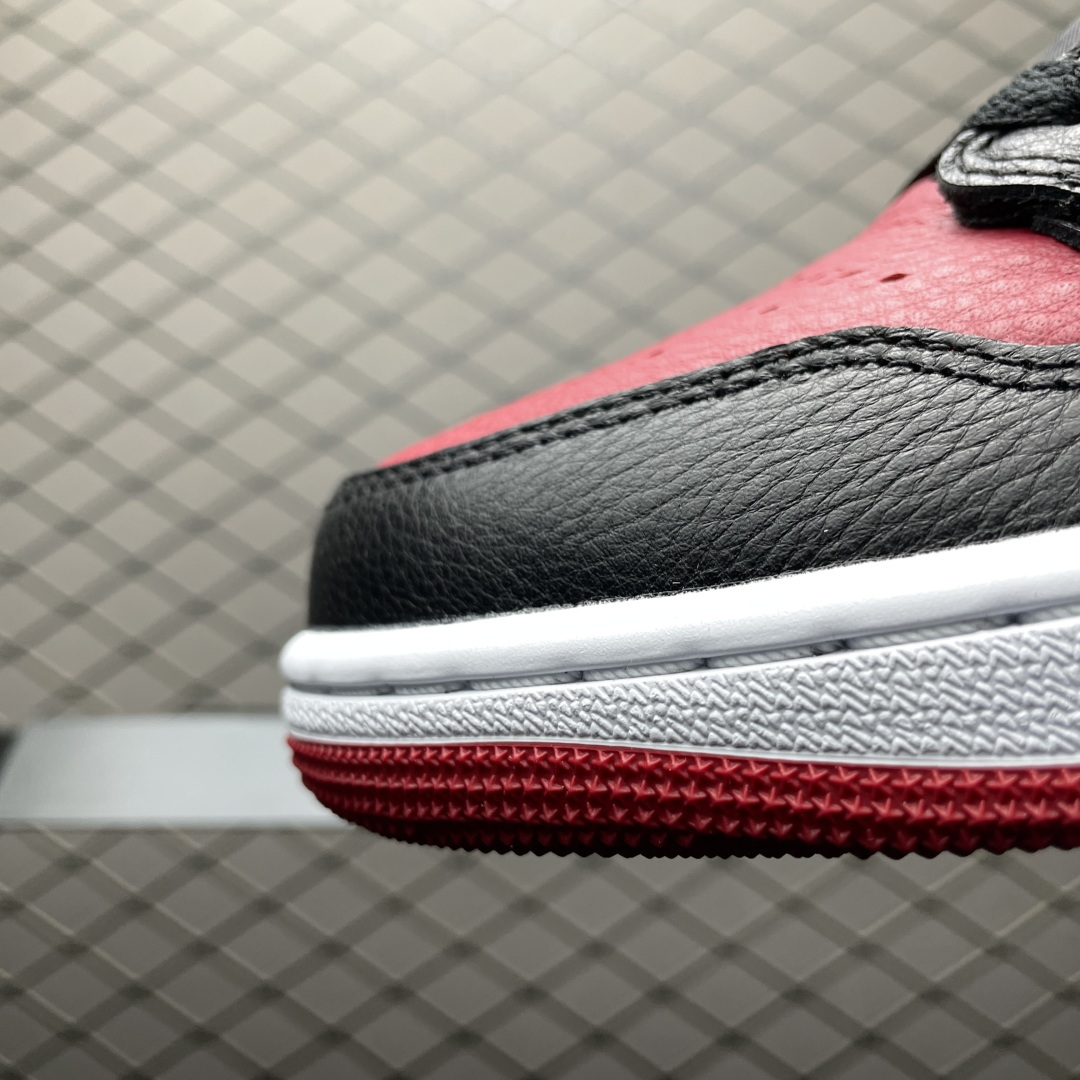 Jordan 1 Retro Low OG Banned 1 Jordan 1 Retro Low OG Banned sneakers worn on foot, lifestyle image