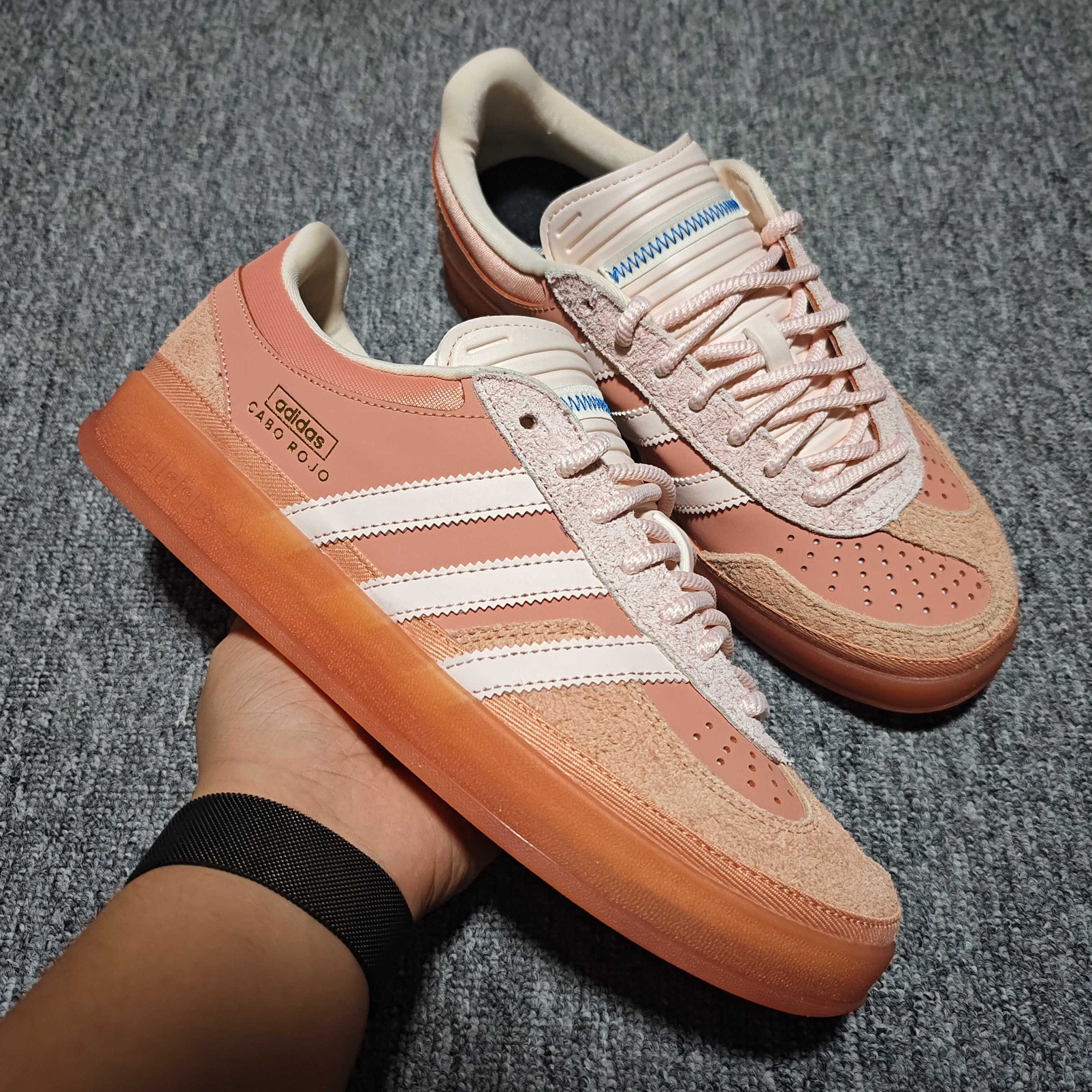 YegKing Cabo Rojo Gazelle catalogue pair with dusty pink side panels, pale stripes, textured toe overlays and brown-orange sole edges